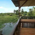 Tung\'S Tropika - With A Wooden Hut By A Lake